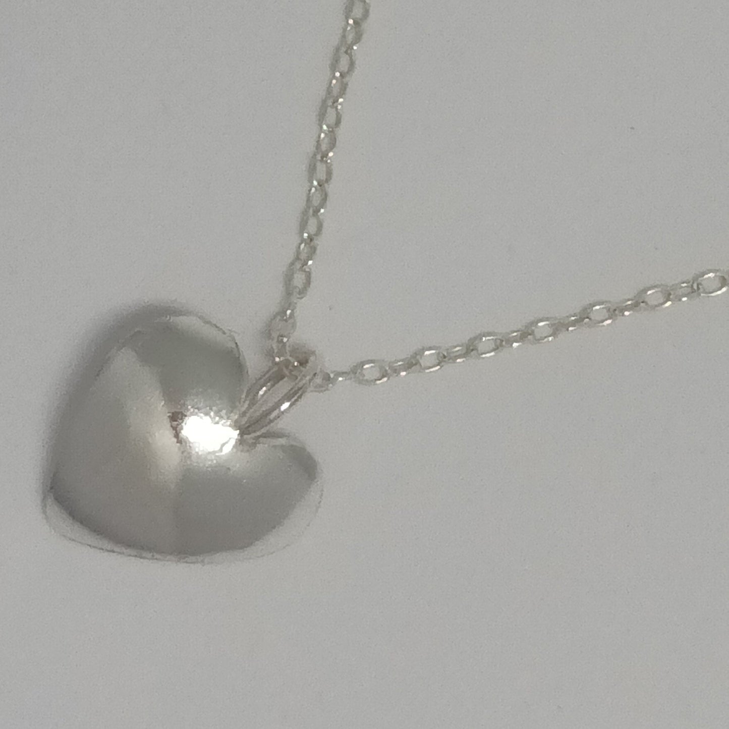 Sterling silver domed heart pendant necklace on 18 inch chain, handmade in Scotland