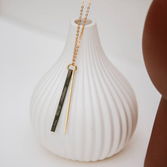 Copper Bee Double Bar Geometric Necklace featuring a gold-plated bar and contrasting matte black square-profile bar on a delicate gold-plated chain.