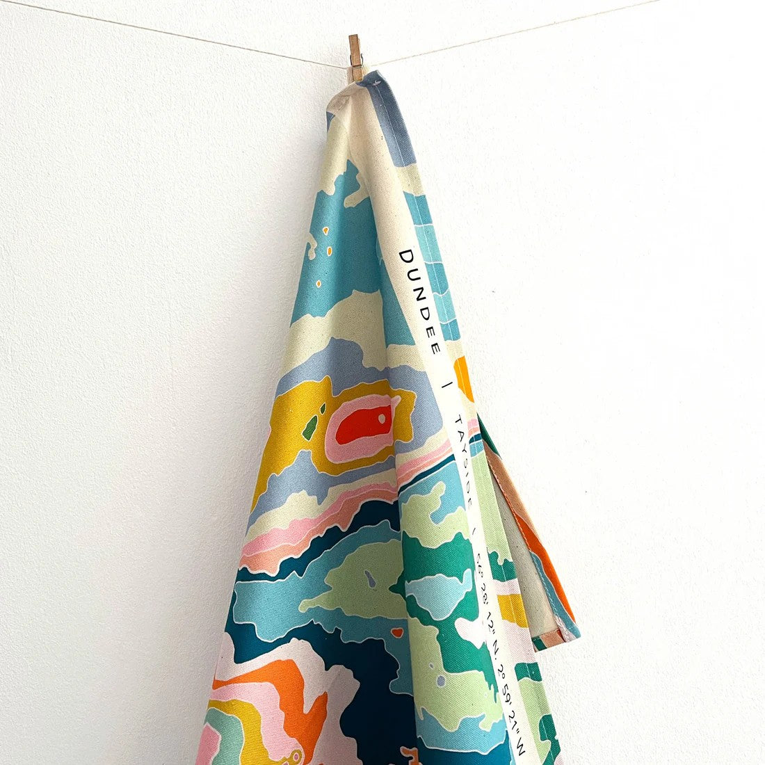 Colourful Dundee topographical tea towel by Kilo Papa Studio, digitally printed on organic cotton with contour map design.