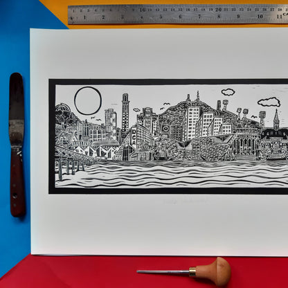 Dundee Cityscape Black and White Lino Print on a colourful background with a ruler at the top