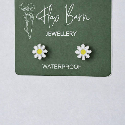 Flax Barn enamel flower stud earrings in tarnish resistant PVD-plated stainless steel on a display card