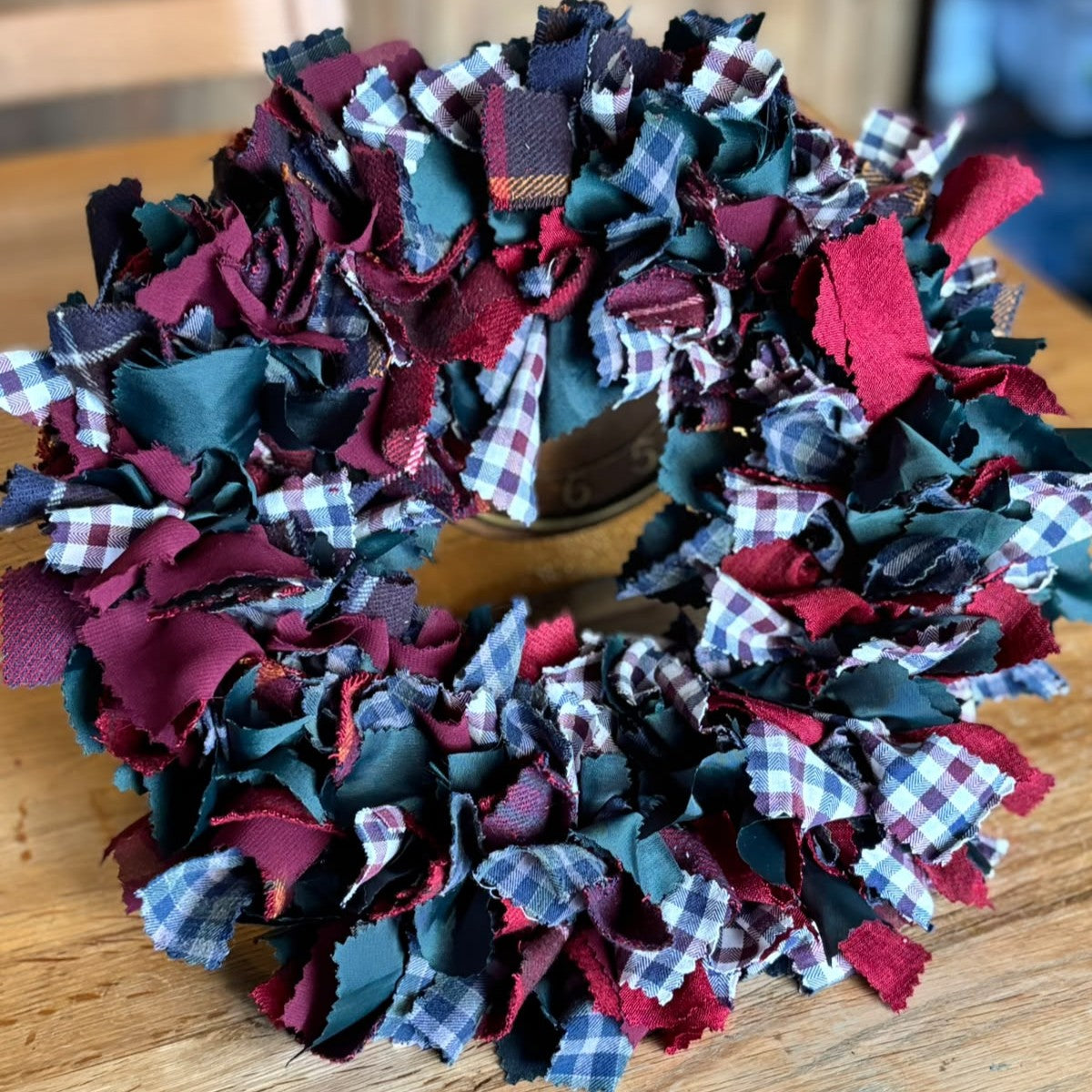 Christmas wreath made using strips of recycled fabric for a festive wreath-making workshop at HAYM in Carnoustie.