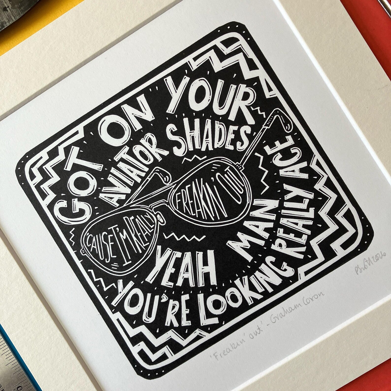 Freakin' Out by Graham Coxon Black and White Lino Print on a colourful background