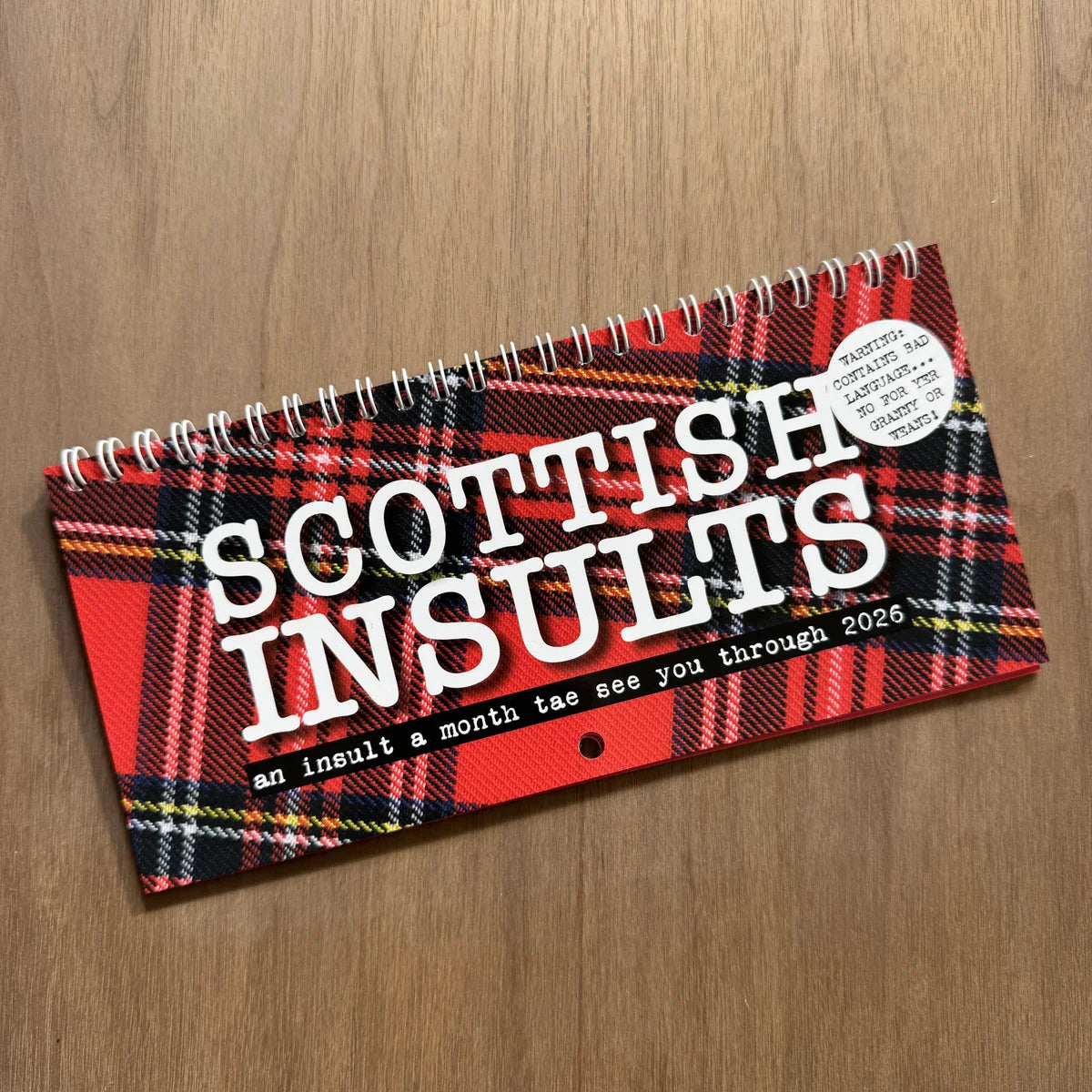 DL-sized 2026 Scottish Insult Calendar featuring bold Scots insults paired with colourful tartans.