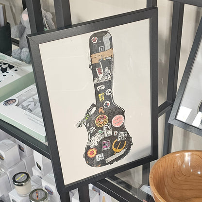 A framed Beebirds artwork print of a much loved guitar case titled 'TIME FLIES'