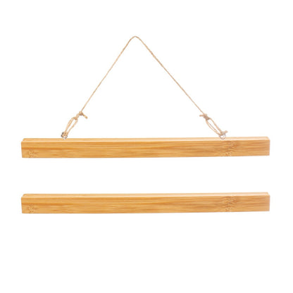 Wooden poster display hanger secured by magnetic clasps, holding a piece of artwork or photograph. The frame measures 22cm long.