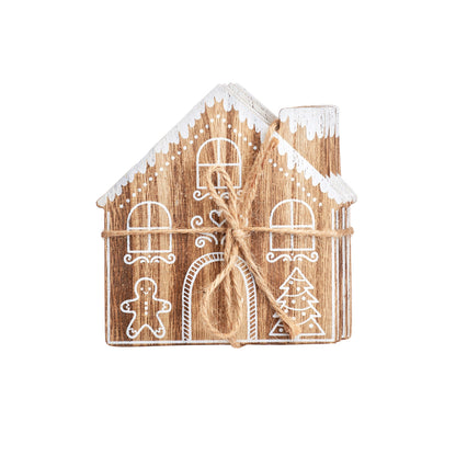 Set of 4 wooden coasters shaped like gingerbread houses with intricate festive details.
