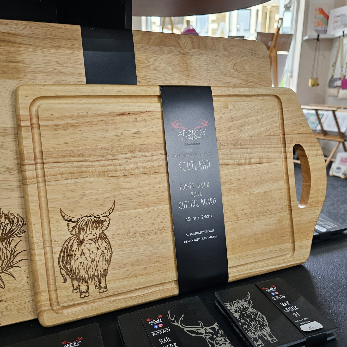 Scottish Hevea wood serving board by Ardroy Creations with cut-out handle and Highland Coo design