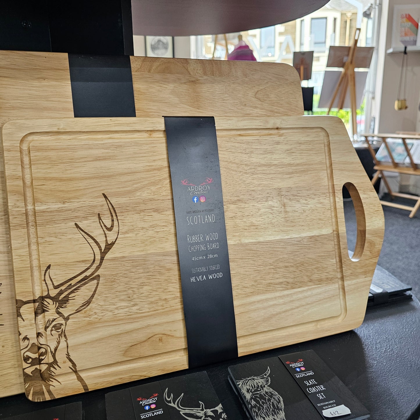 Scottish Hevea wood serving board by Ardroy Creations with cut-out handle and Stag design