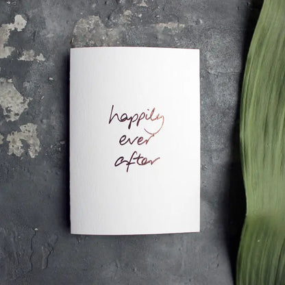 Happily Ever After A6 wedding card with rose gold foil, hand-printed on 360gsm Fedrigoni card, blank inside, matching envelope included