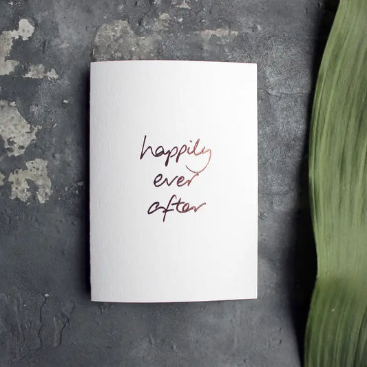 Happily Ever After A6 wedding card with rose gold foil, hand-printed on 360gsm Fedrigoni card, blank inside, matching envelope included