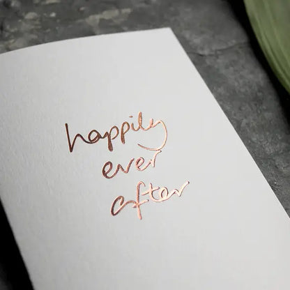 Happily Ever After A6 wedding card with rose gold foil, hand-printed on 360gsm Fedrigoni card, blank inside, matching envelope included