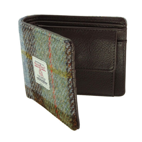 Compact Harris Tweed wool wallet purse with polyester lining, compartments for coins, credit cards and banknotes, measuring 11 x 9 x 3cm.