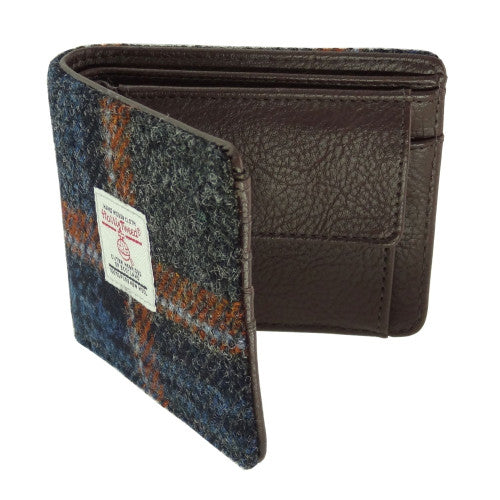 Compact Harris Tweed wool wallet purse with polyester lining, compartments for coins, credit cards and banknotes, measuring 11 x 9 x 3cm.