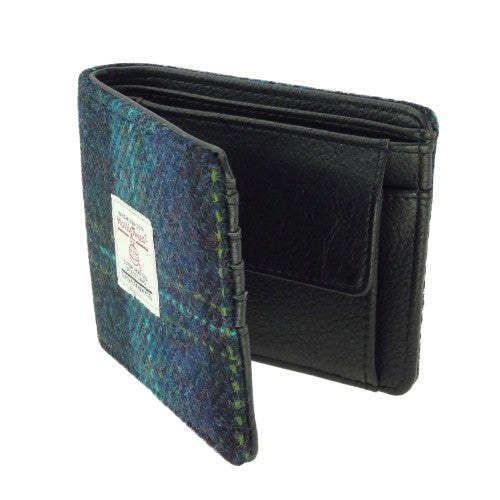 Compact Harris Tweed wool wallet purse with polyester lining, compartments for coins, credit cards and banknotes, measuring 11 x 9 x 3cm.