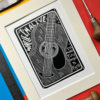 Head Rolls Off by Frightened Rabbit. Black and White Lino Print on a colourful background