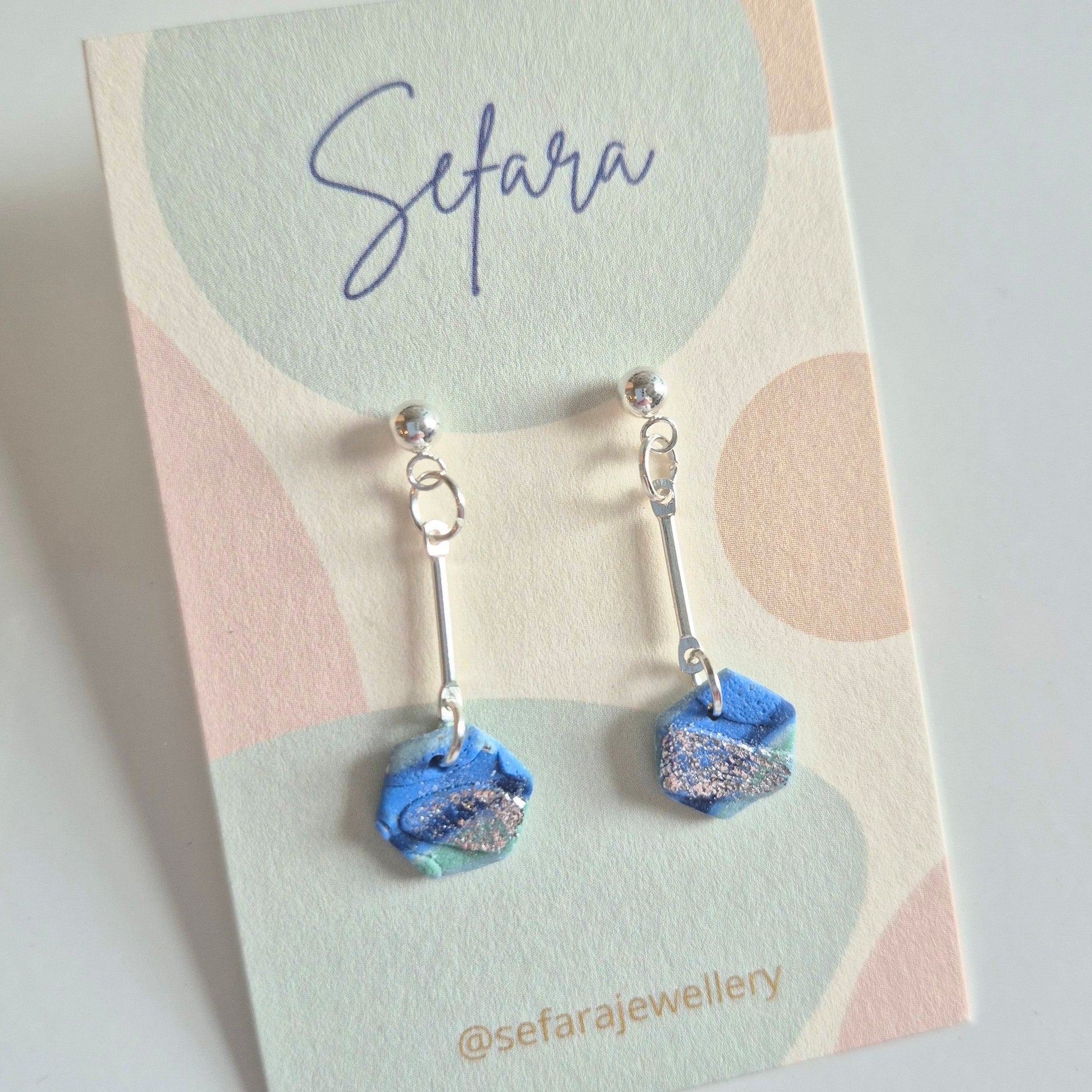 Sefara Jewellery hexagonal drop earrings with silver leaf detail, handmade in Scotland and inspired by the Scottish coastline