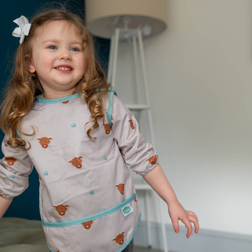 Highland Cow long sleeve waterproof bib for babies aged 6-24 months with full clothing protection
