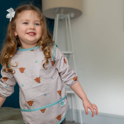 Highland Cow long sleeve waterproof bib for babies aged 6-24 months with full clothing protection