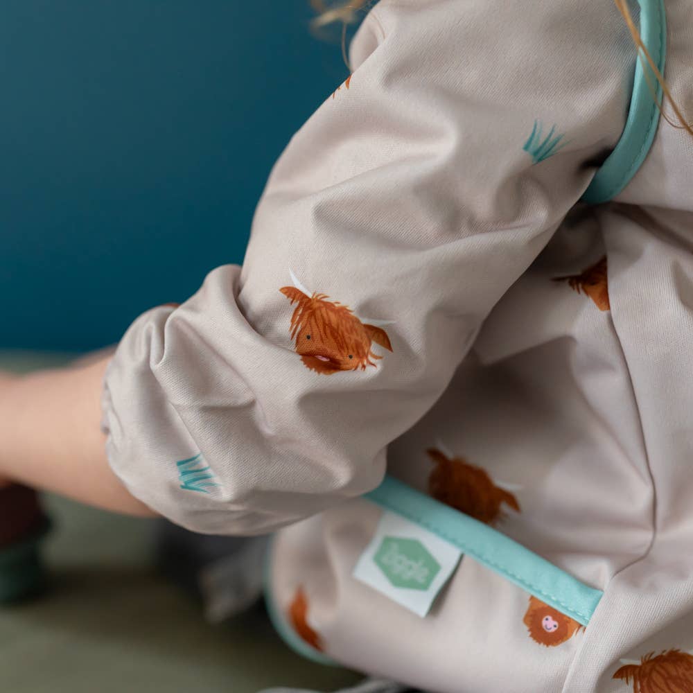 Highland Cow long sleeve waterproof bib for babies aged 6-24 months with full clothing protection