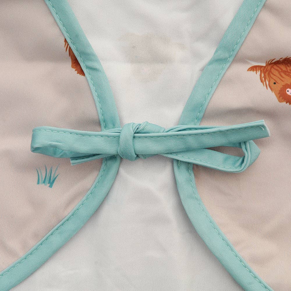 Highland Cow long sleeve waterproof bib for babies aged 6-24 months with full clothing protection