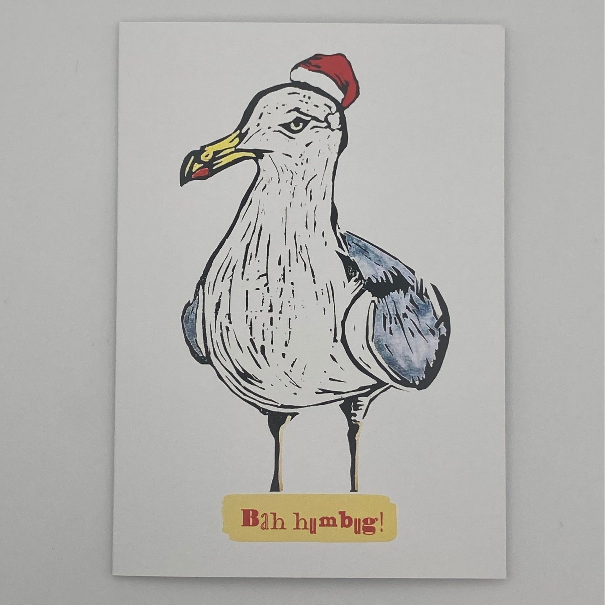 Seagull wearing a Santa hat with the text “Bah Humbug”, colourful BeeBirds Christmas card design.