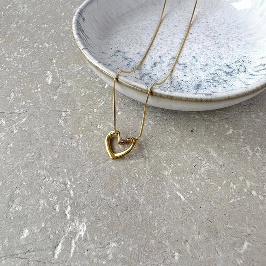 Flax Barn Intertwined Heart Necklace featuring an elegant linked heart design crafted from waterproof, tarnish-resistant PVD-plated stainless steel.