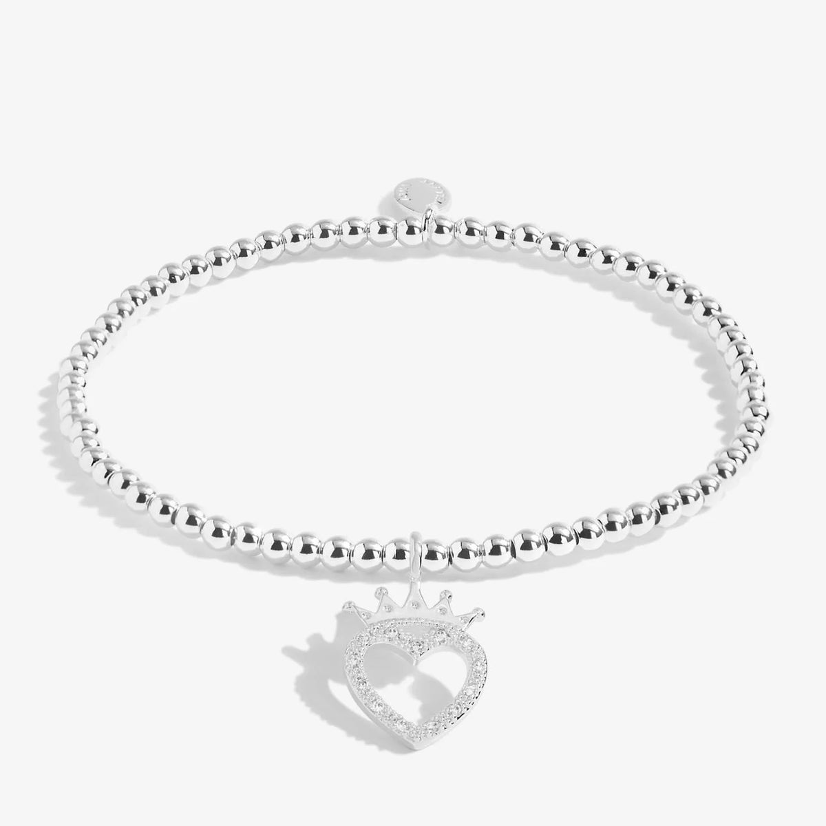 A silver Joma bracelet with a crowned heart charm, packaged in a card that reads 'A Little BIRTHDAY QUEEN'.