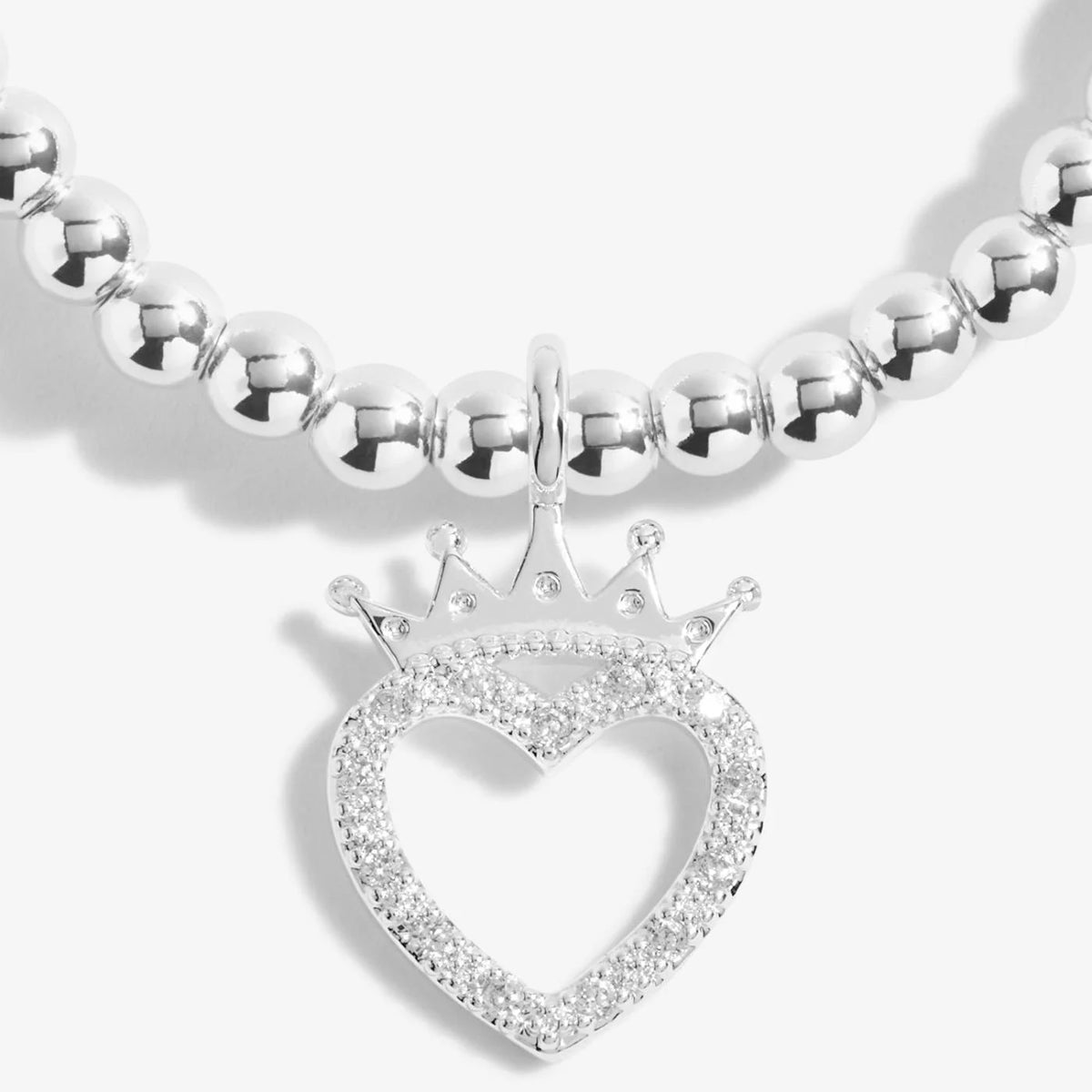 A silver Joma bracelet with a crowned heart charm, packaged in a card that reads 'A Little BIRTHDAY QUEEN'.