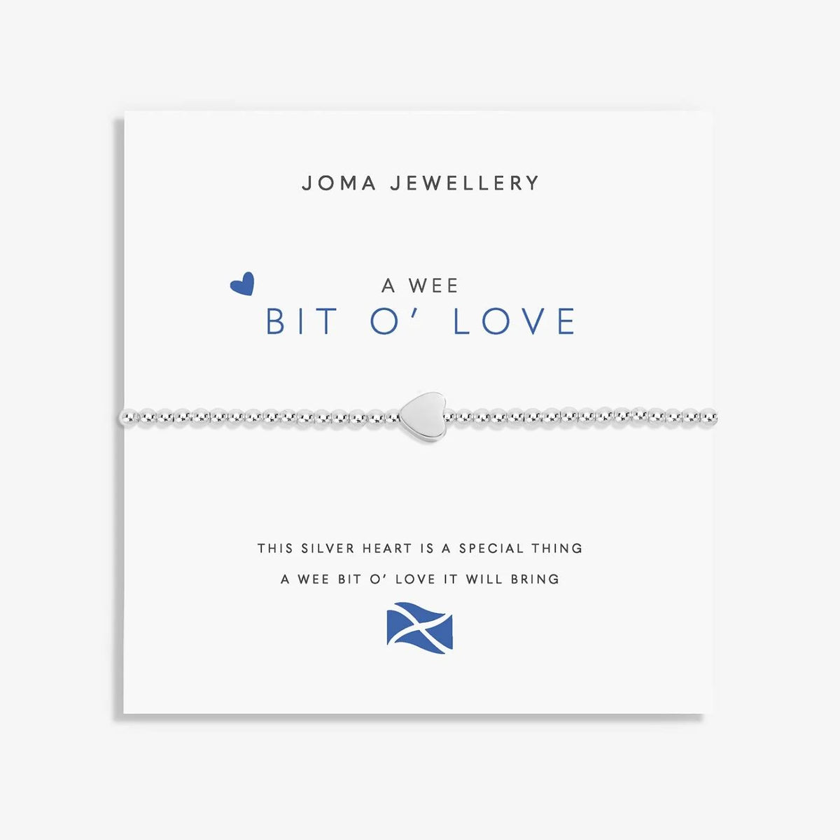 A silver Joma bracelet with a heart charm, packaged in a card that reads 'A Wee BIT O' LOVE'.
