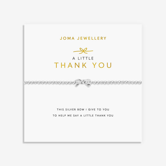 A silver Joma bracelet with a bow charm, packaged in a card that reads 'A Little THANK YOU'.