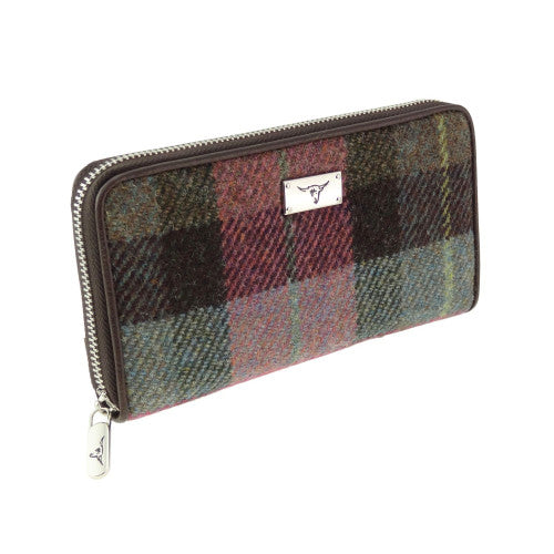 Harris Tweed Staffa Long Zip Purses in assorted colours and tartans, featuring a central zipped coin compartment with card holders and banknote sections.