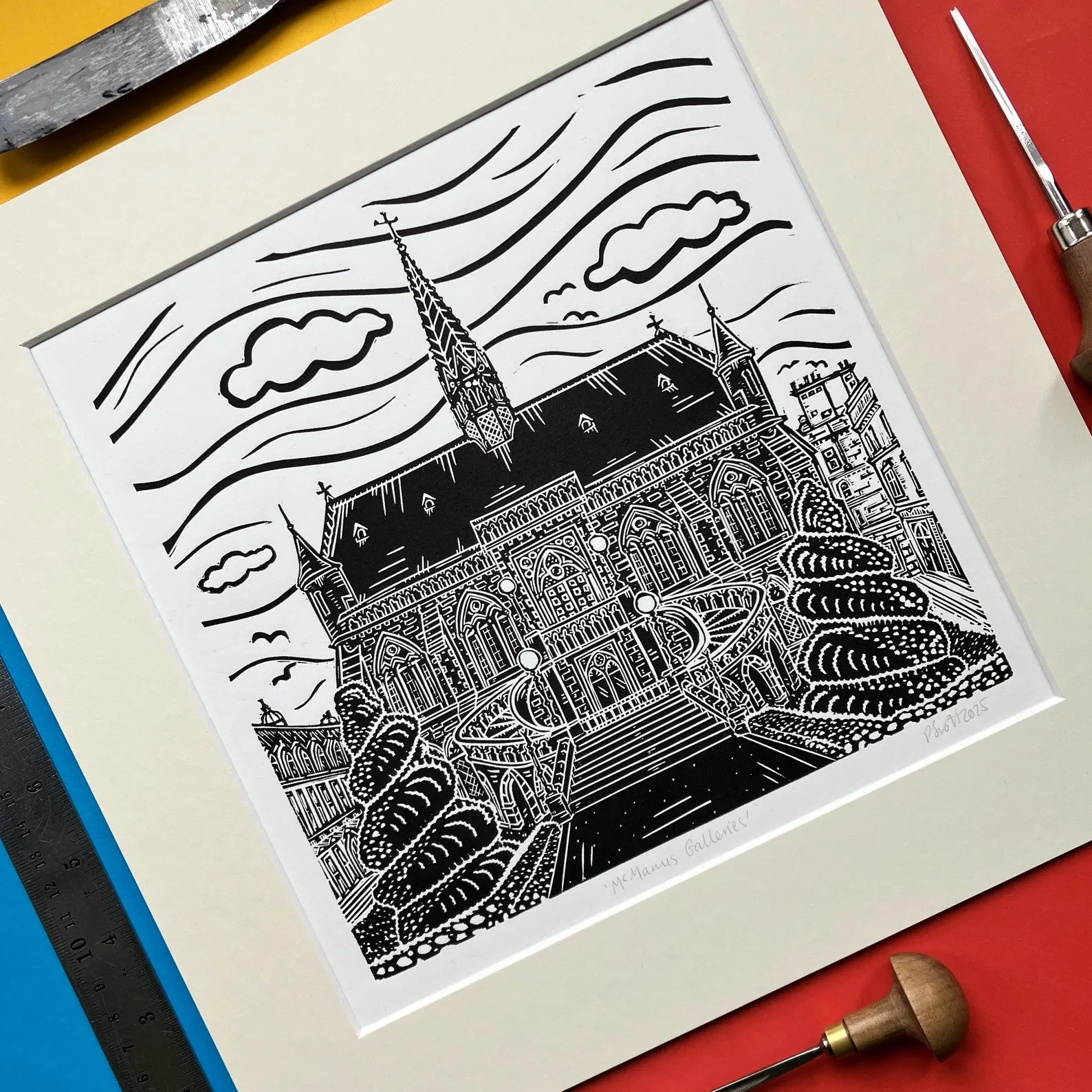 Square black-and-white linocut print of The McManus Art Gallery and Museum in Dundee by Pamela Scott, mounted in antique white.