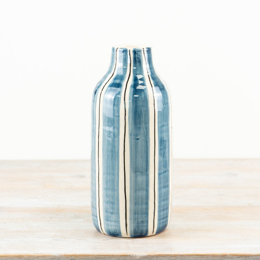 Blue and white striped ceramic decorative vase ideal for flowers or as a standalone statement piece in any home décor setting.