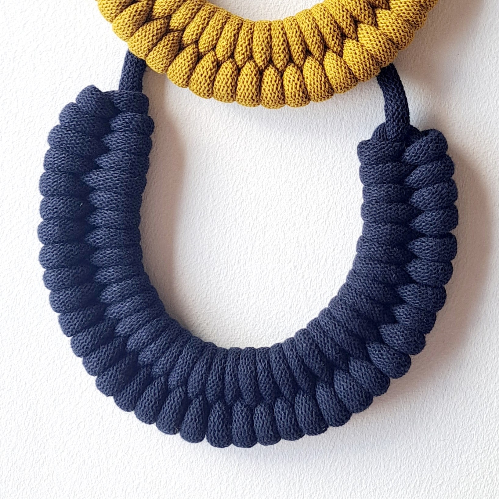 Ragged House large recycled cotton macrame cord knot necklace with figure 8 bow-shaped statement design