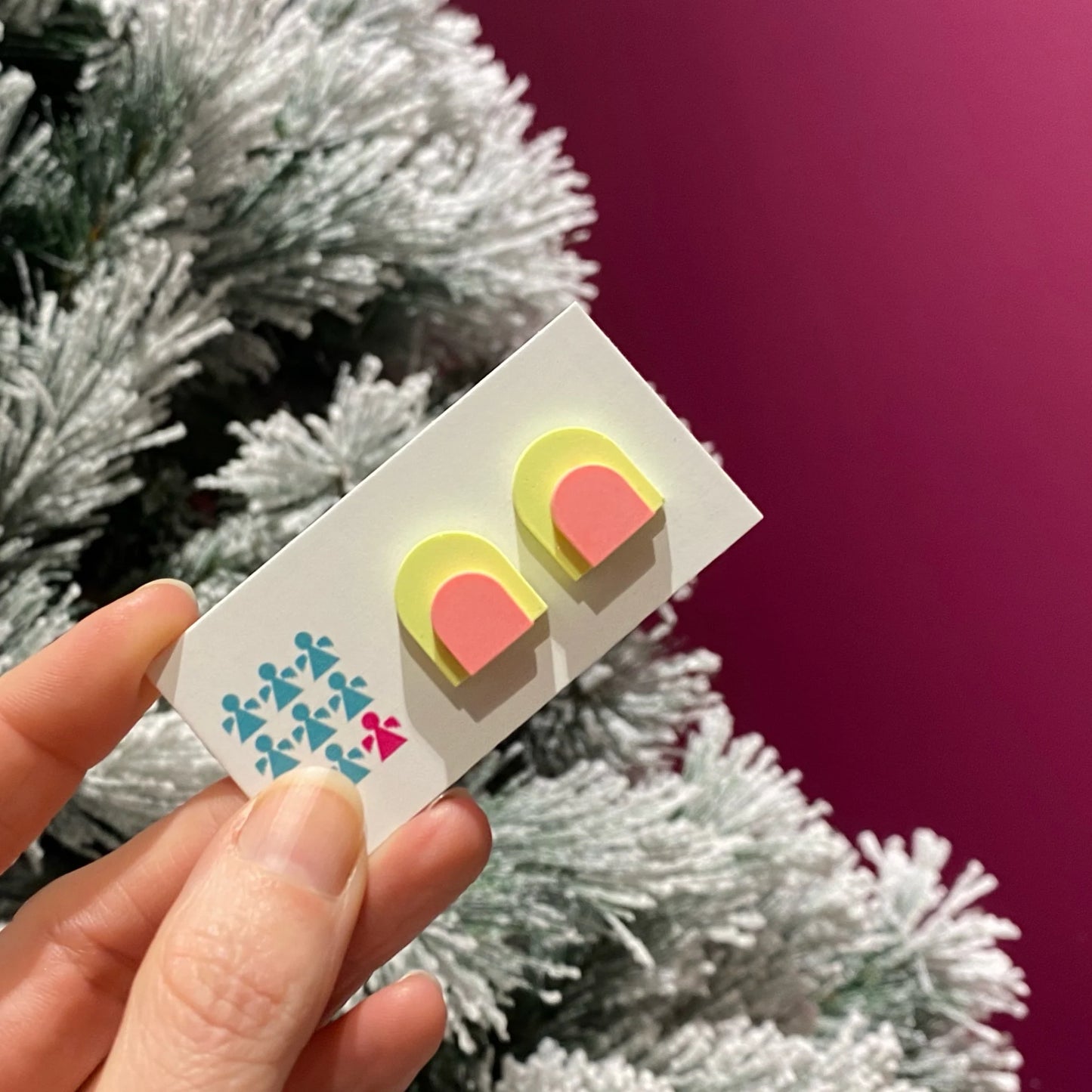 Zero-waste neon Jesmonite arch stud earrings by Nine Angels with stainless steel posts.