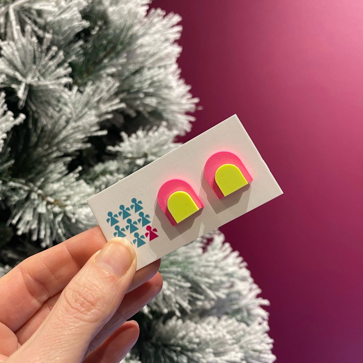 Zero-waste neon Jesmonite arch stud earrings by Nine Angels with stainless steel posts.