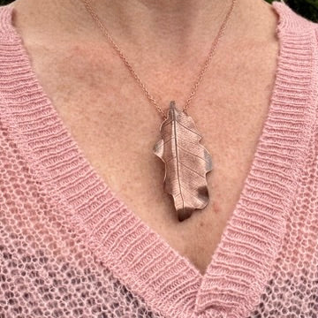 Rowan Berry Jewellery handcrafted copper oak leaf necklaces in three styles: simple leaf, sculptural statement leaf and oak leaf with sterling silver tiger's eye acorn.