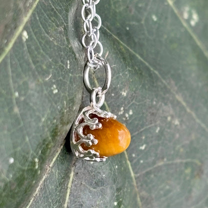 Rowan Berry Jewellery handcrafted copper oak leaf necklaces in three styles: simple leaf, sculptural statement leaf and oak leaf with sterling silver tiger's eye acorn.