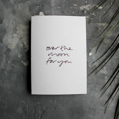 Over The Moon For You A6 congratulations card with rose gold foil, hand-printed on 360gsm Fedrigoni card