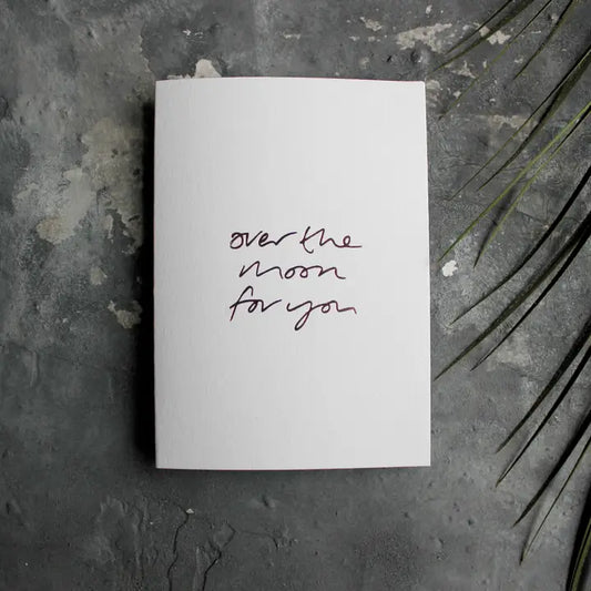 Over The Moon For You A6 congratulations card with rose gold foil, hand-printed on 360gsm Fedrigoni card