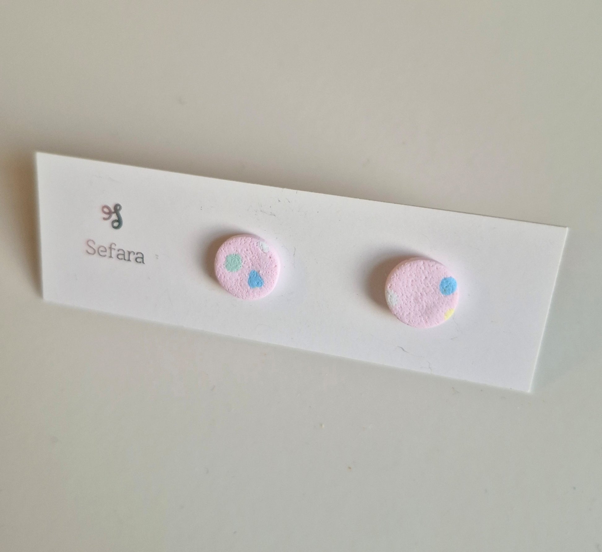 Pale Pink Multi Sefara round stud earrings on a branded card