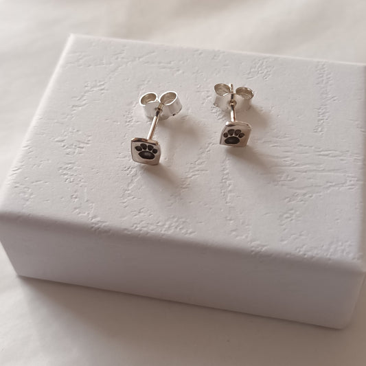 Sterling silver paw print stud earrings by Diana King handmade in Perthshire