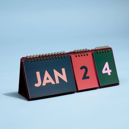 Designworks Ink Colourblock perpetual desk calendar with bold coloured pages and a freestanding A-frame design