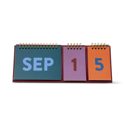 Designworks Ink Colourblock perpetual desk calendar with bold coloured pages and a freestanding A-frame design