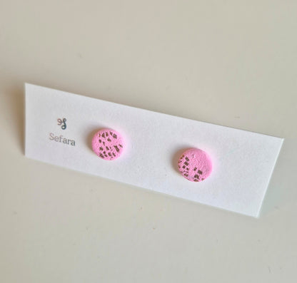 Pink and gold Sefara round stud earrings on a branded card