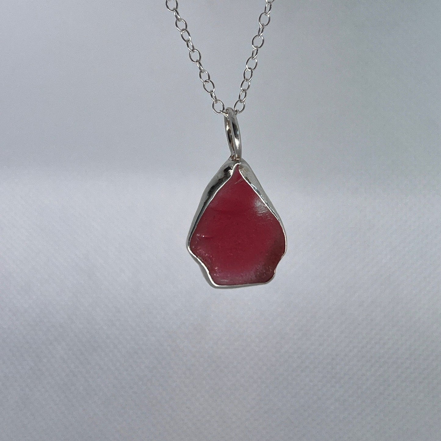 Sterling silver and pink sea glass pendant necklace handmade in Dundee with triangle shape design