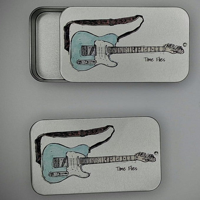 Silver tins with Blue electric guitar images and 'Time Flies' text on the sliding lids.