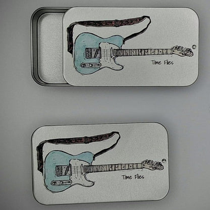 Silver tins with Blue electric guitar images and 'Time Flies' text on the sliding lids.