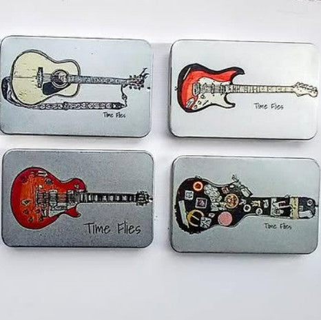 Four metallic plectrum tins with guitar illustrations and 'Time Files' on the sliding lids